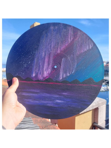 Creación de cuadros sobre discos de vinilo reciclados en Gijón